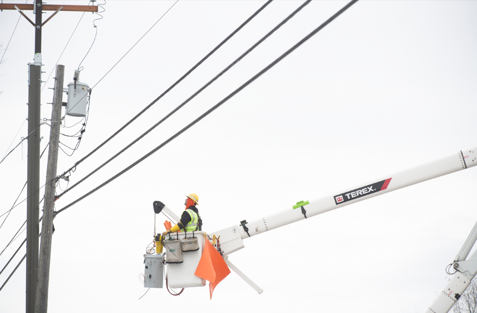 a worker in a bucket truck