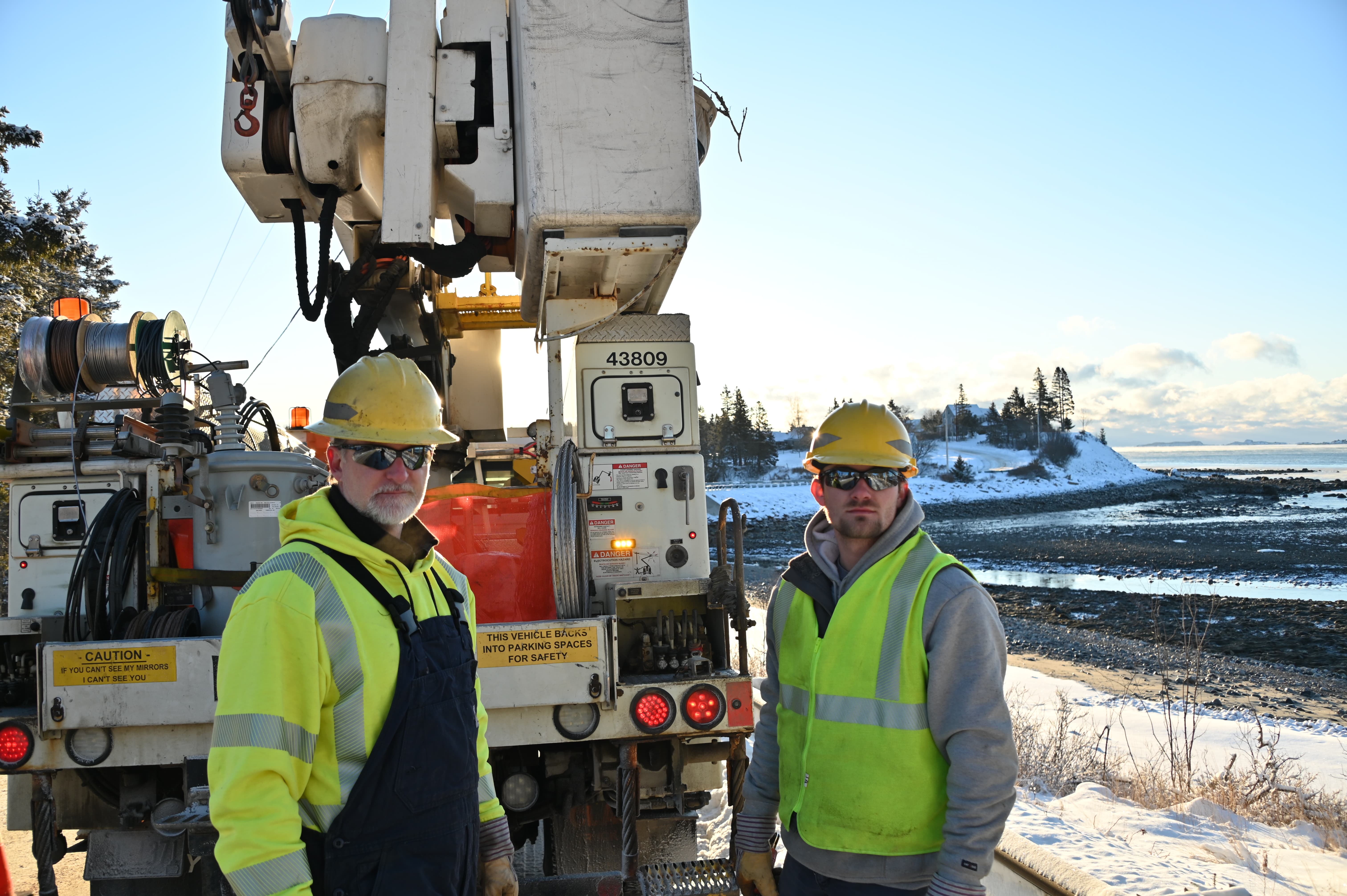 Two Gentlemen and a Utility Truck