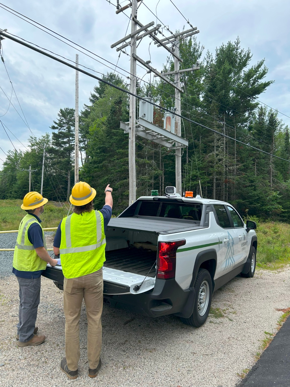 Jacob Larsen, Versant Power Transmission Development Engineer I, points at some of the equipment that will be upgraded.