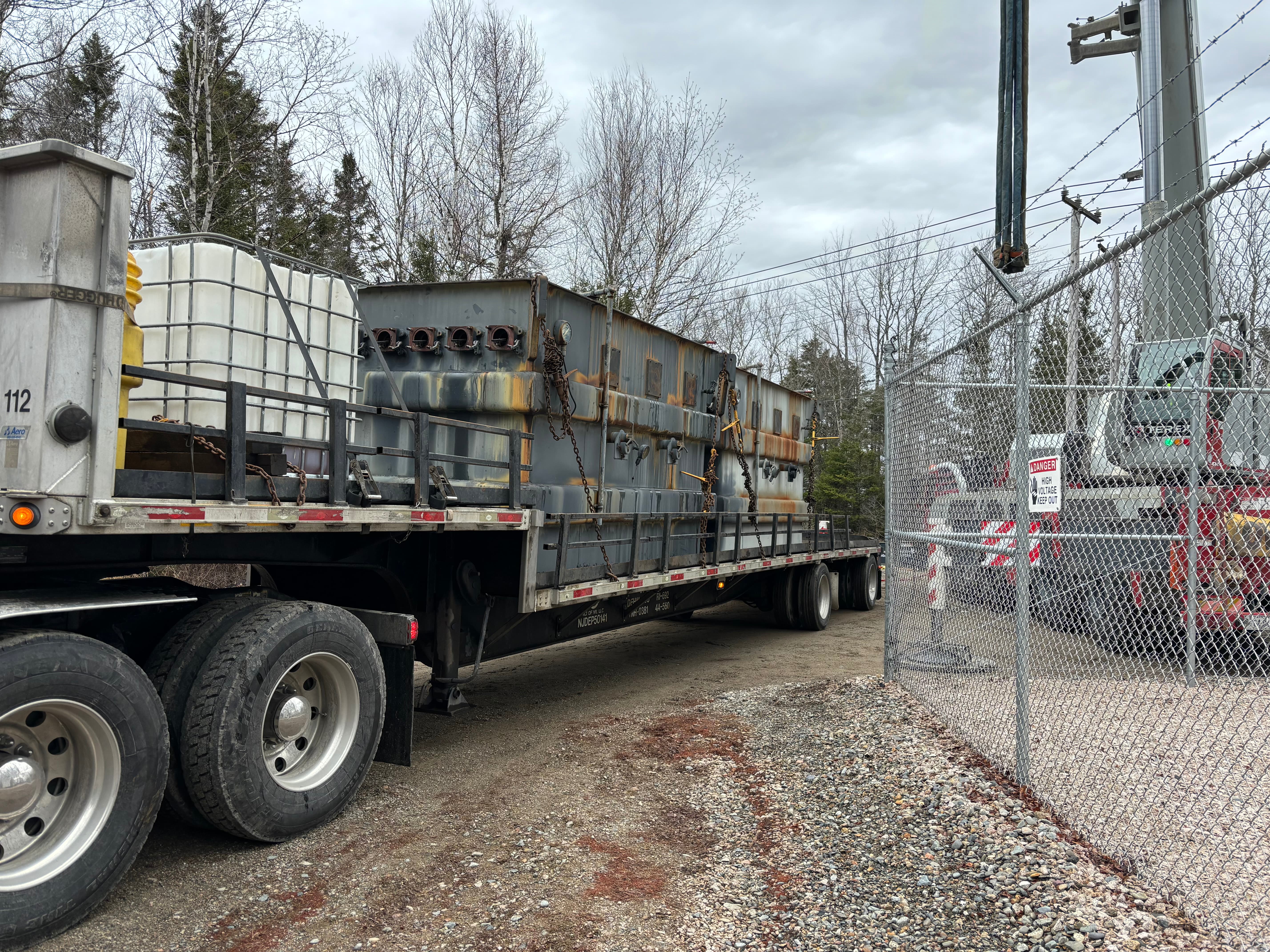 A Versant Power truck carrying substation components.